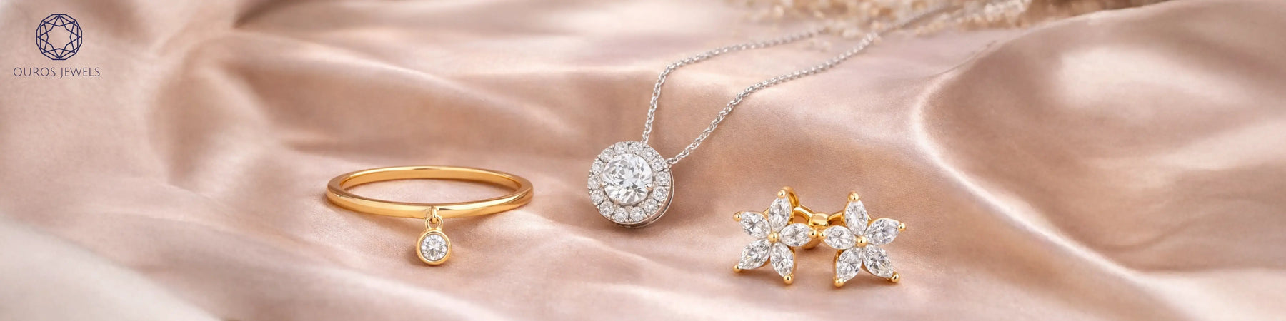 Lab-grown diamond ring, pendant necklace, and flower earrings by Ouros Jewels