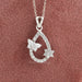 Open Pear Shaped Butterfly And Round Cut Pendant