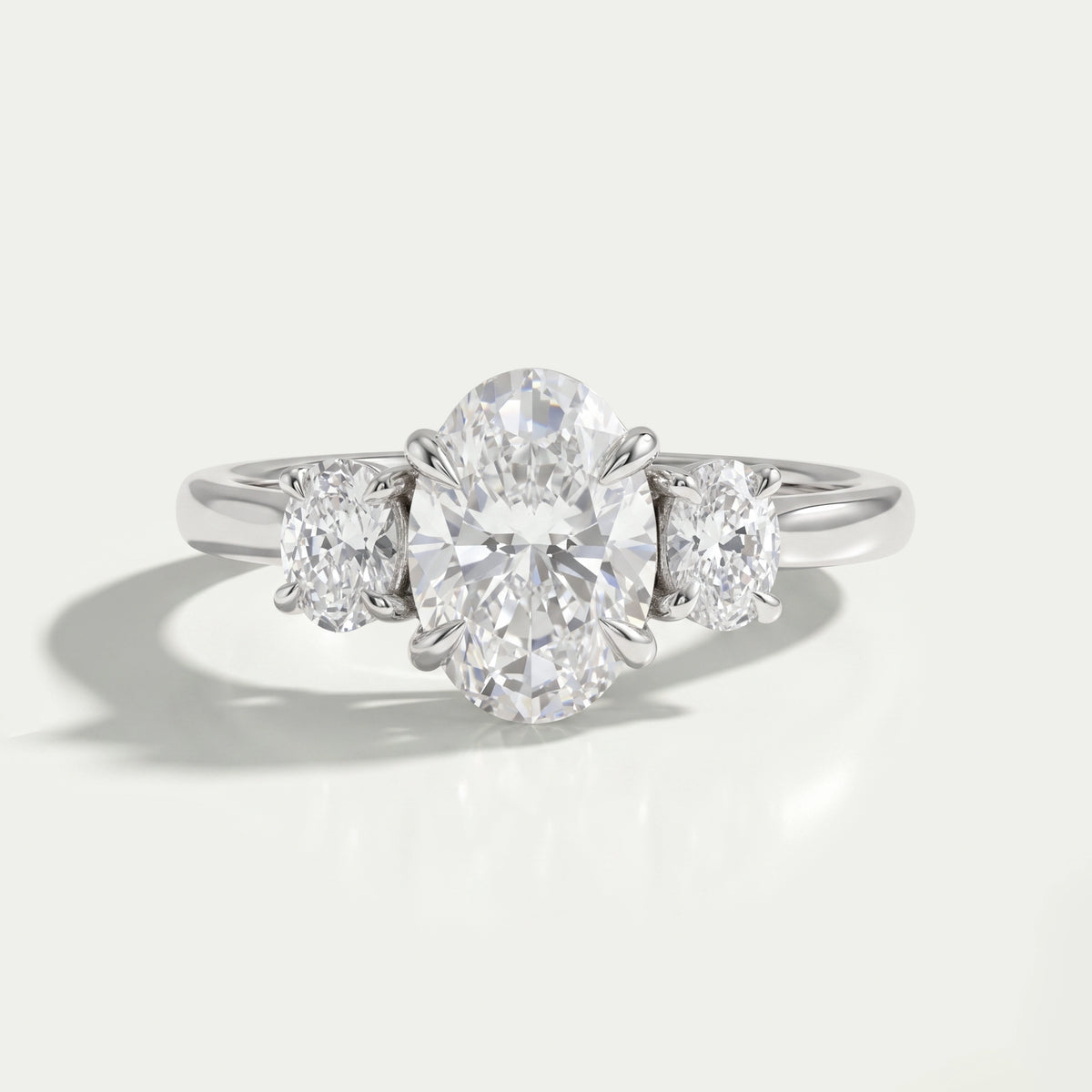 Oval Cut Lab Grown Diamond Three Stone Engagement Ring