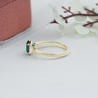 Trilogy Zambian Green Oval Gemstone And Trillion Cut Ring